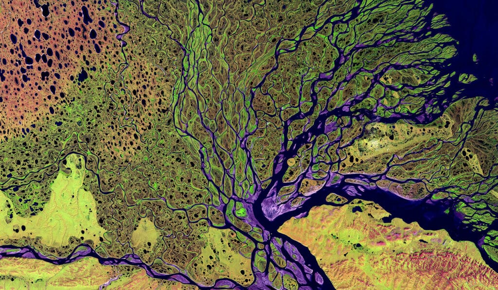 overhead enhanced drone view of a river delta